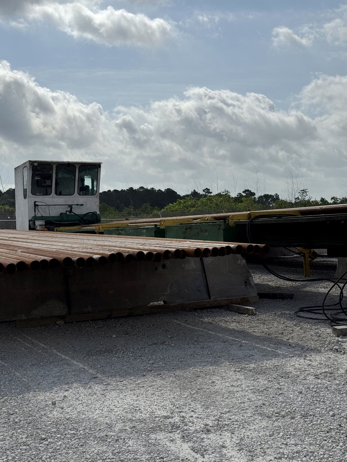 Tubular pipe staged at an OFS inspection yard